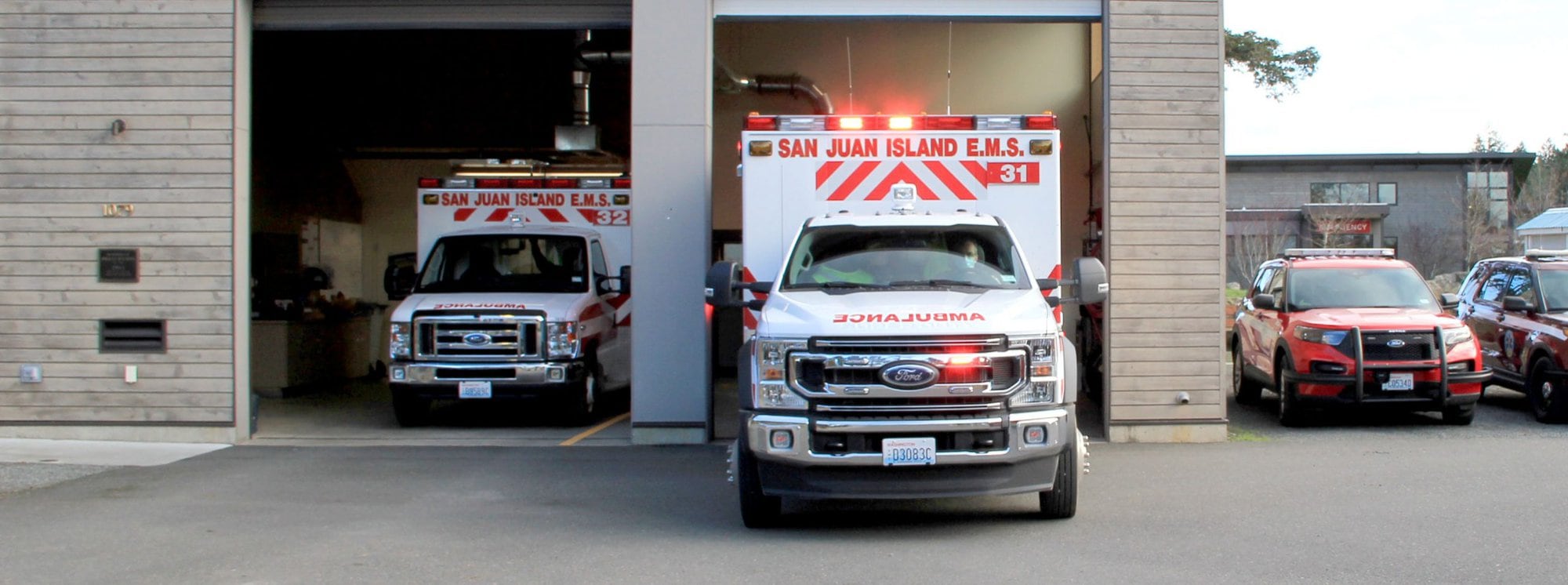 San Juan EMS Ambulances Leaving Garage
